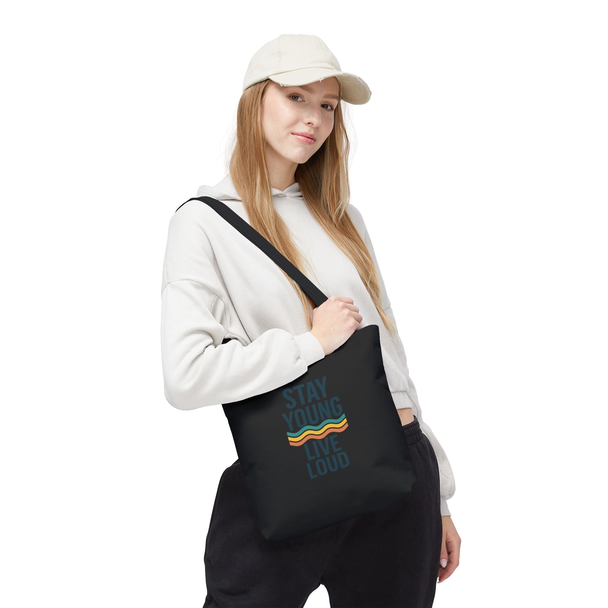 Stay Young, Live Loud Tote Bag-Carry confidence everywhere. This bold tote features Forever Young’s signature slogan and a retro wave design — built to move with you from errands to adventures.