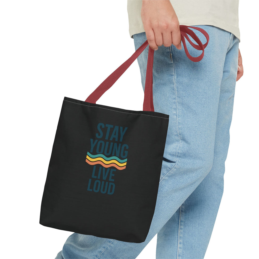 Stay Young, Live Loud Tote Bag-Carry confidence everywhere. This bold tote features Forever Young’s signature slogan and a retro wave design — built to move with you from errands to adventures.